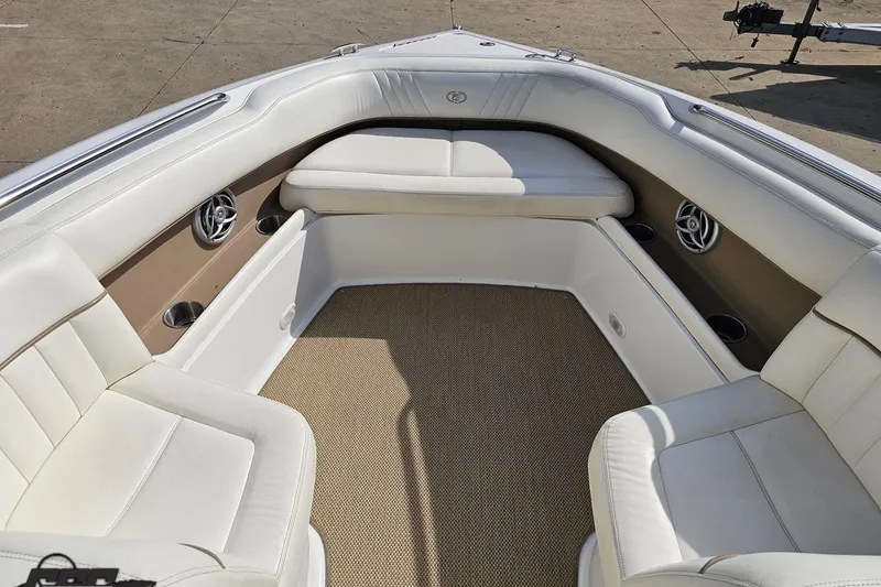 Slide: The Image of 2007 Cobalt 252 boat interior with white seating and beige carpet. - 77