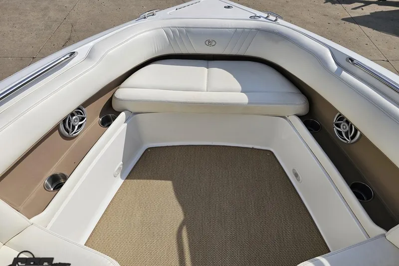 Slide: The Image of Interior of a 2007 Cobalt 252 boat with white seating and beige flooring. - 78