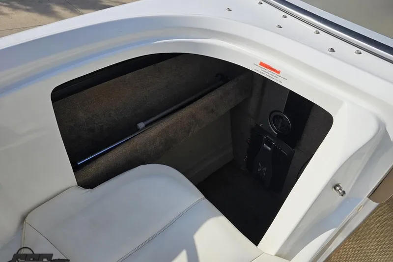 Slide: The Image of Interior view of a 2007 Cobalt 252 boat, featuring seating and storage area. - 79