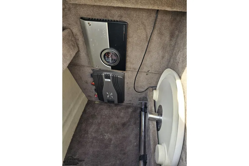 Slide: The Image of 2007 Cobalt 252 interior showing audio equipment and storage compartment. - 80