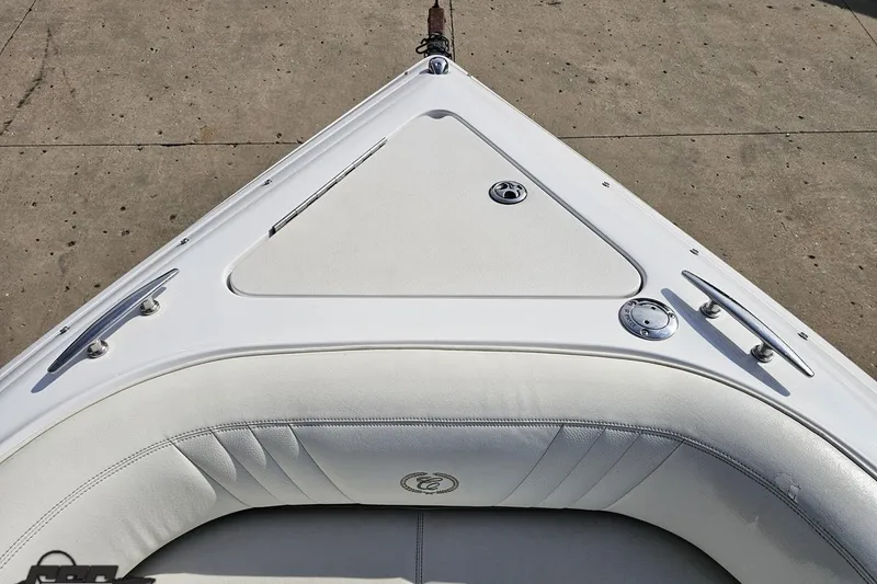 Slide: The Image of Bow of 2007 Cobalt 252 boat with white seating and deck details. - 81