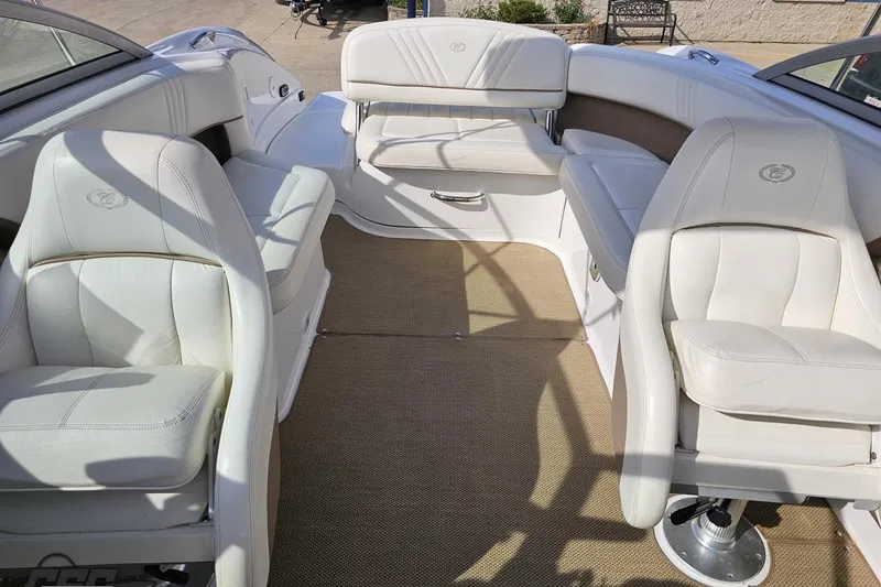 Slide: The Image of Interior of a 2007 Cobalt 252 boat with white leather seating. - 85