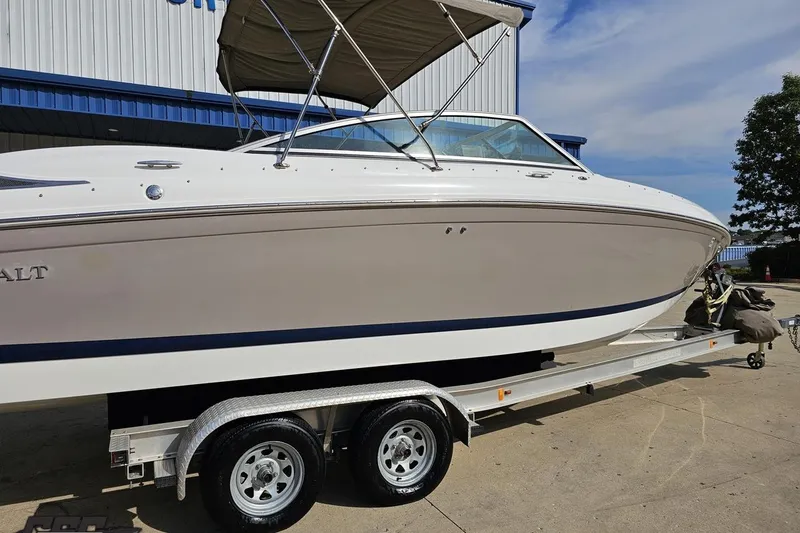 Slide: The Image of 2007 Cobalt 252 boat on trailer, white exterior, parked outdoors. - 9
