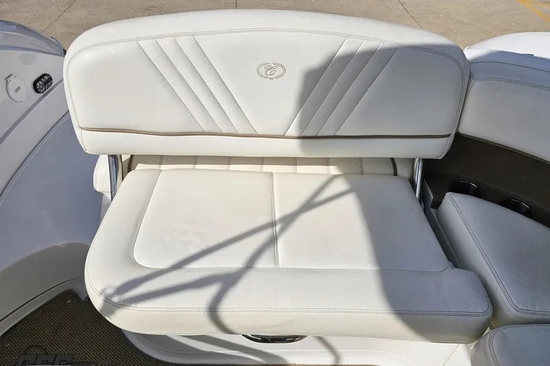 Slide: The Image of White leather seating on a 2007 Cobalt 252 boat, featuring elegant stitching. - 93