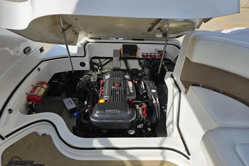 Slide: The Image of 2007 Cobalt 252 boat engine compartment with open hatch, showcasing engine and components. - 96