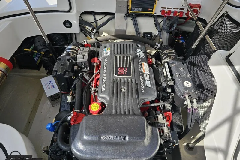 Slide: The Image of Engine compartment of a 2007 Cobalt 252 boat featuring a Volvo Penta 8.1 Gi engine. - 97