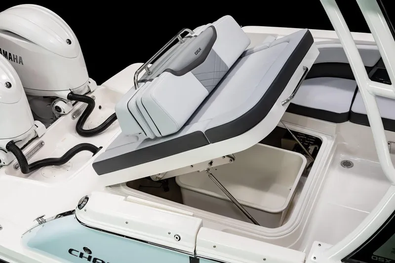Slide: The Image of Manufacturer Provided Image: 2025 Chaparral 280 OSX boat interior, featuring sleek seating and storage compartments. - 11
