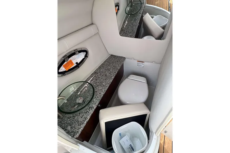Slide: The Image of 2023 Crownline 280 XSS boat bathroom with granite countertop and modern fixtures. - 13