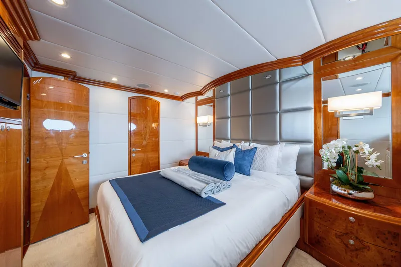 Slide: The Image of Luxurious bedroom interior on 2009 Hargrave Raised Pilothouse yacht, featuring elegant wood finishes. - 14