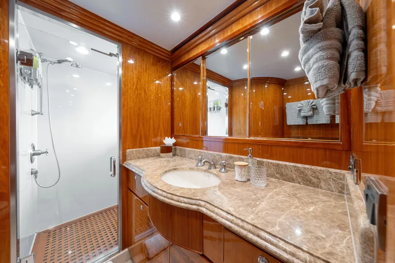 Slide: The Image of Luxurious bathroom in 2009 Hargrave Raised Pilothouse yacht with marble countertop and glass shower. - 17