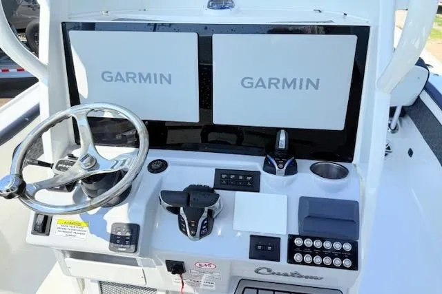 Slide: The Image of 2024 Tidewater 2700 Carolina Bay boat with rod holders and speakers on the T-top. - 10