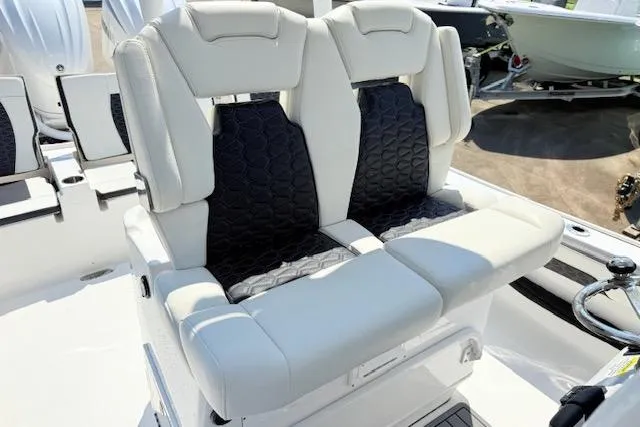 Slide: The Image of 2024 Tidewater 2700 Carolina Bay boat with speakers and LED lights on the canopy. - 18