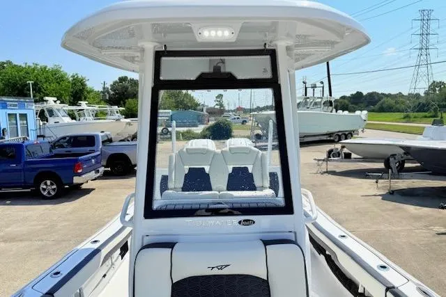 Slide: The Image of 2024 Tidewater 2700 Carolina Bay boat interior with black and white seating. - 24