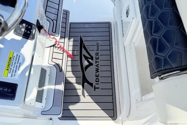 Slide: The Image of 2024 Tidewater 2700 Carolina Bay boat, featuring a sleek design and spacious seating area. - 25
