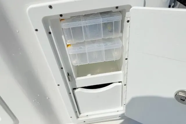 Slide: The Image of 2024 Tidewater 2700 Carolina Bay boat interior with branded flooring and seating. - 26