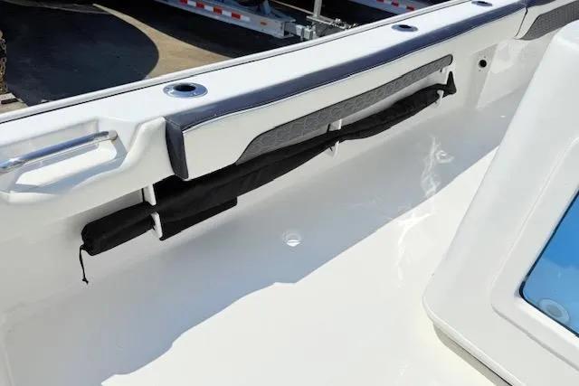 Slide: The Image of Storage compartment on 2024 Tidewater 2700 Carolina Bay boat with organized tackle boxes. - 27