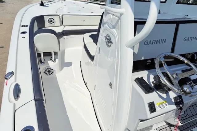 Slide: The Image of 2024 Tidewater 2700 Carolina Bay boat interior detail with rod holder and sleek design. - 28