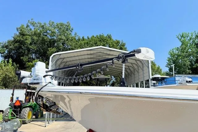 Slide: The Image of 2024 Tidewater 2700 Carolina Bay boat on trailer with dual Yamaha engines. - 3