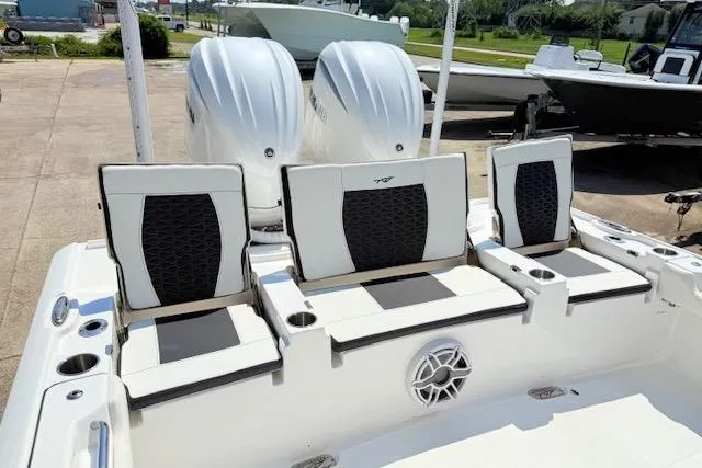 Slide: The Image of 2024 Tidewater 2700 Carolina Bay boat with dual 300 V6 engines, rear view. - 6