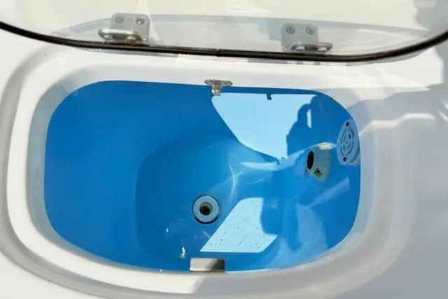 Slide: The Image of 2024 Tidewater 2700 Carolina Bay boat with sink and cup holders on deck. - 8