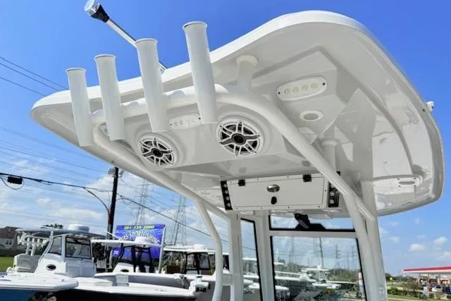 Slide: The Image of 2024 Tidewater 2700 Carolina Bay boat livewell with blue interior and open lid. - 9