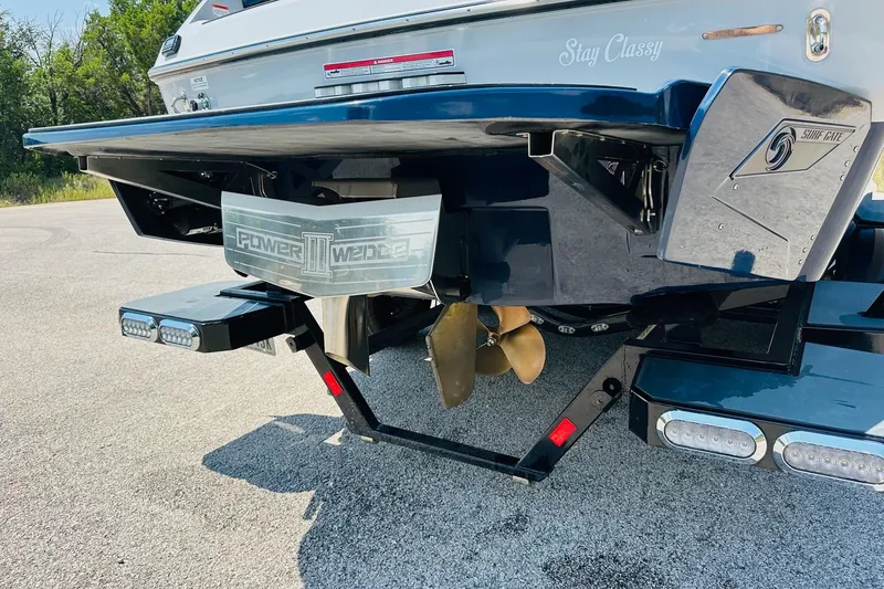 Slide: The Image of 2021 Axis T22 boat rear view with Power Wedge III and propeller. - 14