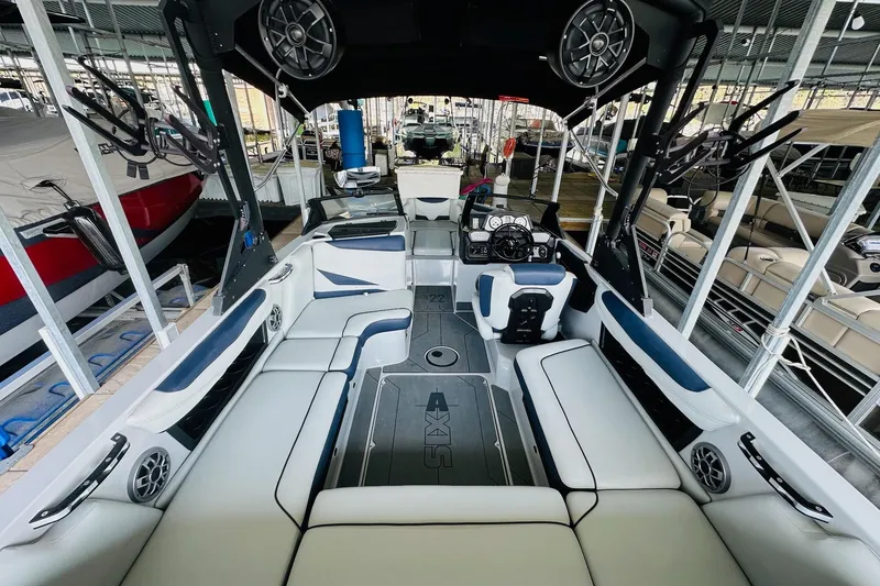 Slide: The Image of 2021 Axis T22 boat interior with spacious seating and modern dashboard. - 16