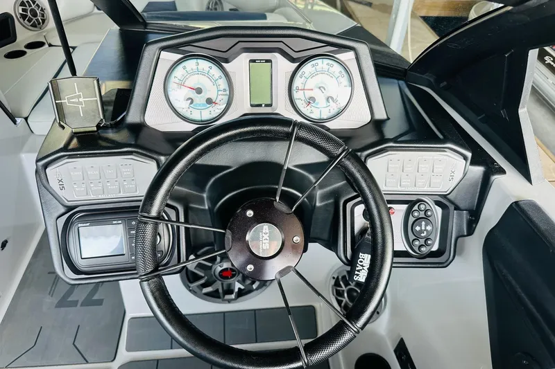 Slide: The Image of 2021 Axis T22 boat dashboard with steering wheel and control panel. - 20