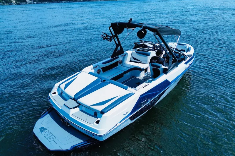 Slide: The Image of 2021 Axis T22 boat on water, featuring sleek design and modern amenities. - 3
