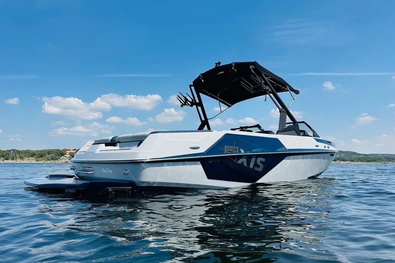 Slide: The Image of 2021 Axis T22 boat on a sunny lake, featuring sleek design and modern features. - 9