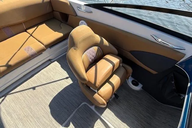 Slide: The Image of 2019 Glastron GT 205 boat interior with tan leather seats and modern design. - 7