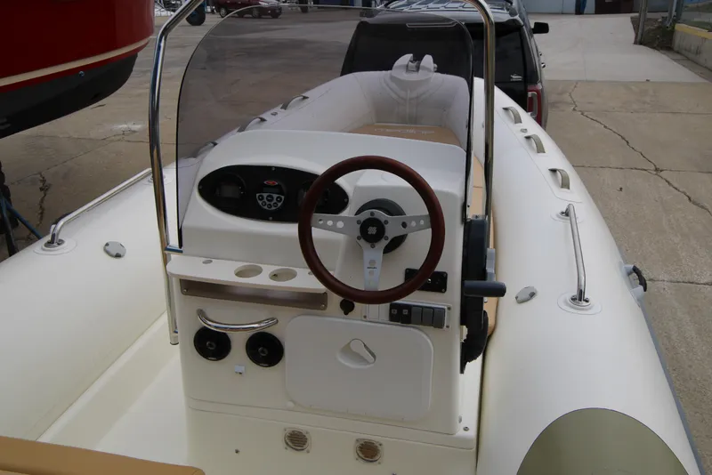 Slide: The Image of 2011 Zodiac Medline 550 NEO boat on trailer, showing hull and winch mechanism. - 14