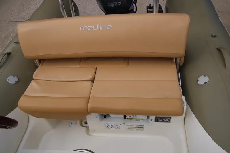 Slide: The Image of Zodiac Medline 550 NEO 2011 boat interior storage compartment with latch. - 27
