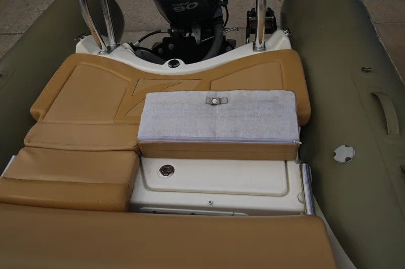 Slide: The Image of Zodiac Medline 550 NEO 2011 boat interior with tan seating and white hull. - 30