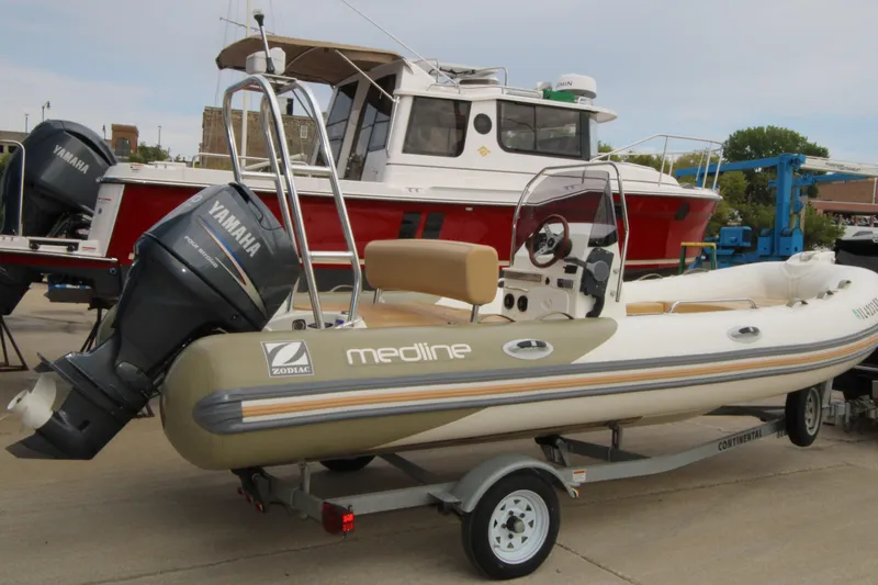 Slide: The Image of 2011 Zodiac Medline 550 NEO boat on trailer, beige seating, Yamaha engine. - 6