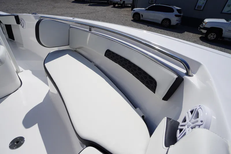 Slide: The Image of 2026 Tidewater 220 LXF boat interior with white cushioned seating and stainless steel railing. - 11