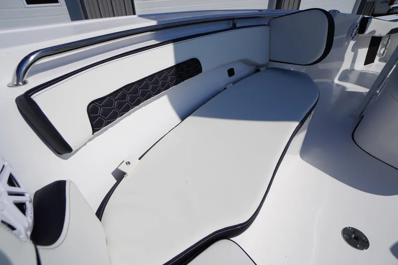 Slide: The Image of 2026 Tidewater 220 LXF boat interior with sleek white seating and modern design. - 12
