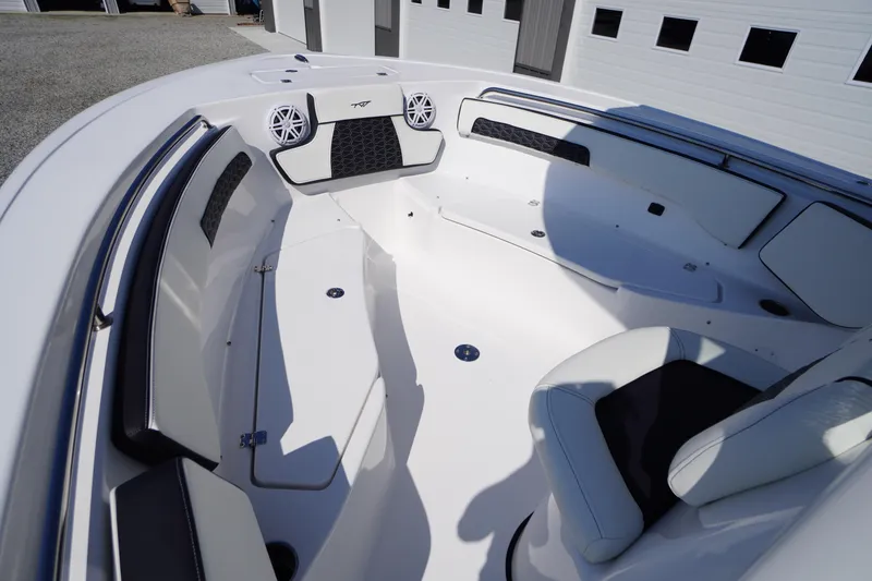 Slide: The Image of 2026 Tidewater 220 LXF boat interior with white seating and modern design. - 16