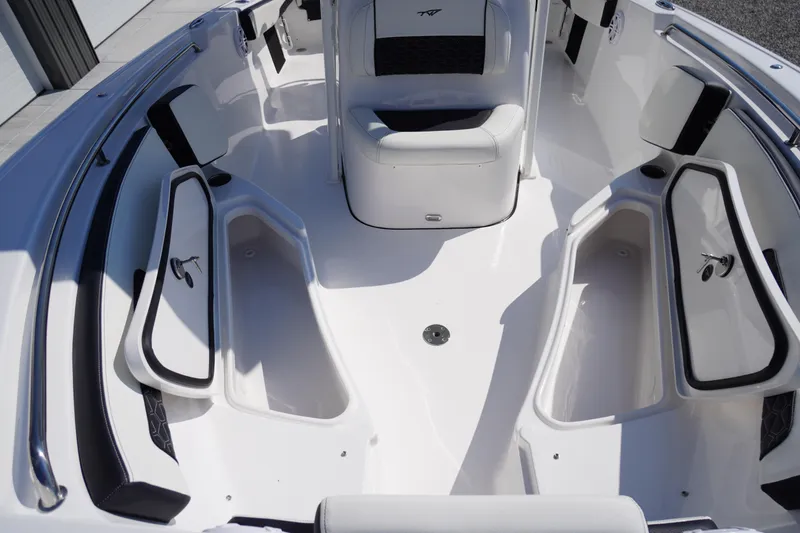 Slide: The Image of 2026 Tidewater 220 LXF boat interior with seating and storage compartments. - 17