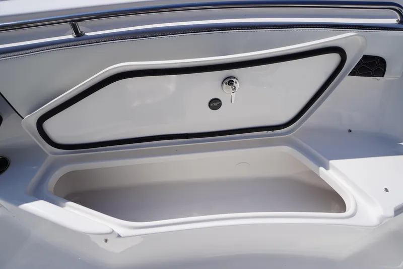Slide: The Image of 2026 Tidewater 220 LXF boat storage compartment with secure lock and sleek design. - 18