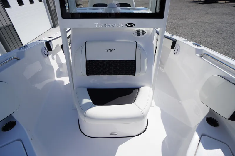 Slide: The Image of 2026 Tidewater 220 LXF boat interior with white seating and black accents. - 20