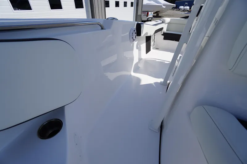 Slide: The Image of 2026 Tidewater 220 LXF boat interior, showcasing sleek white design and modern features. - 22
