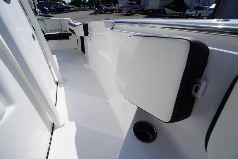 Slide: The Image of 2026 Tidewater 220 LXF boat interior with sleek white seating and modern design. - 23