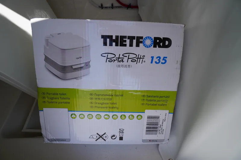 Slide: The Image of Box of Thetford Porta Potti 135 portable toilet inside Tidewater 220 LXF, 2026 model. - 27