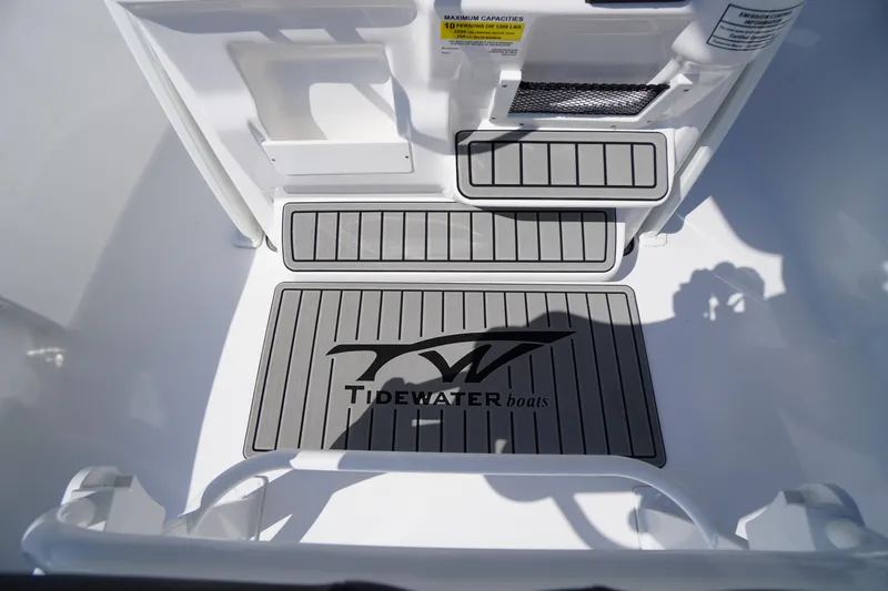 Slide: The Image of 2026 Tidewater 220 LXF boat interior with branded non-slip flooring. - 31