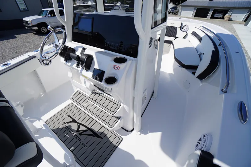 Slide: The Image of 2026 Tidewater 220 LXF boat interior with modern helm and seating. - 32