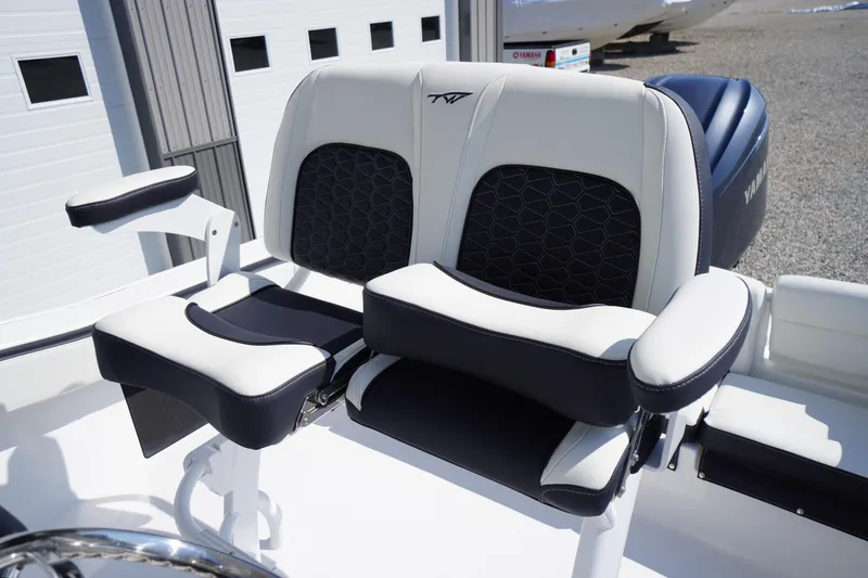 Slide: The Image of 2026 Tidewater 220 LXF boat seating with black and white cushioned design. - 35