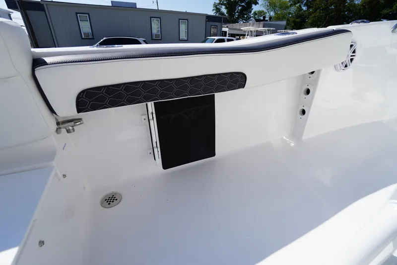 Slide: The Image of 2026 Tidewater 220 LXF boat interior detail with sleek white seating and modern design. - 38
