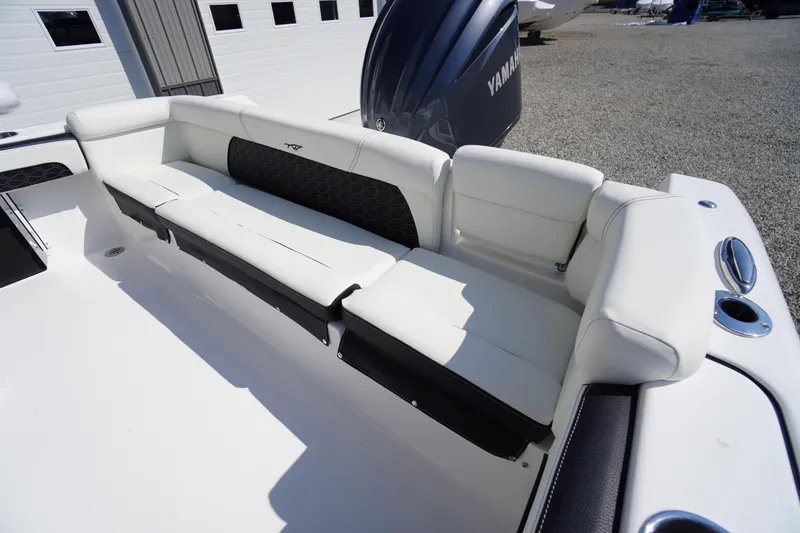 Slide: The Image of 2026 Tidewater 220 LXF boat with white seating and Yamaha engine in a sunny outdoor setting. - 41