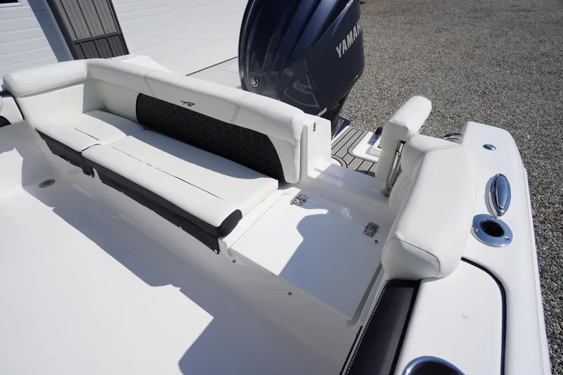 Slide: The Image of 2026 Tidewater 220 LXF boat with white seating and Yamaha engine. - 42